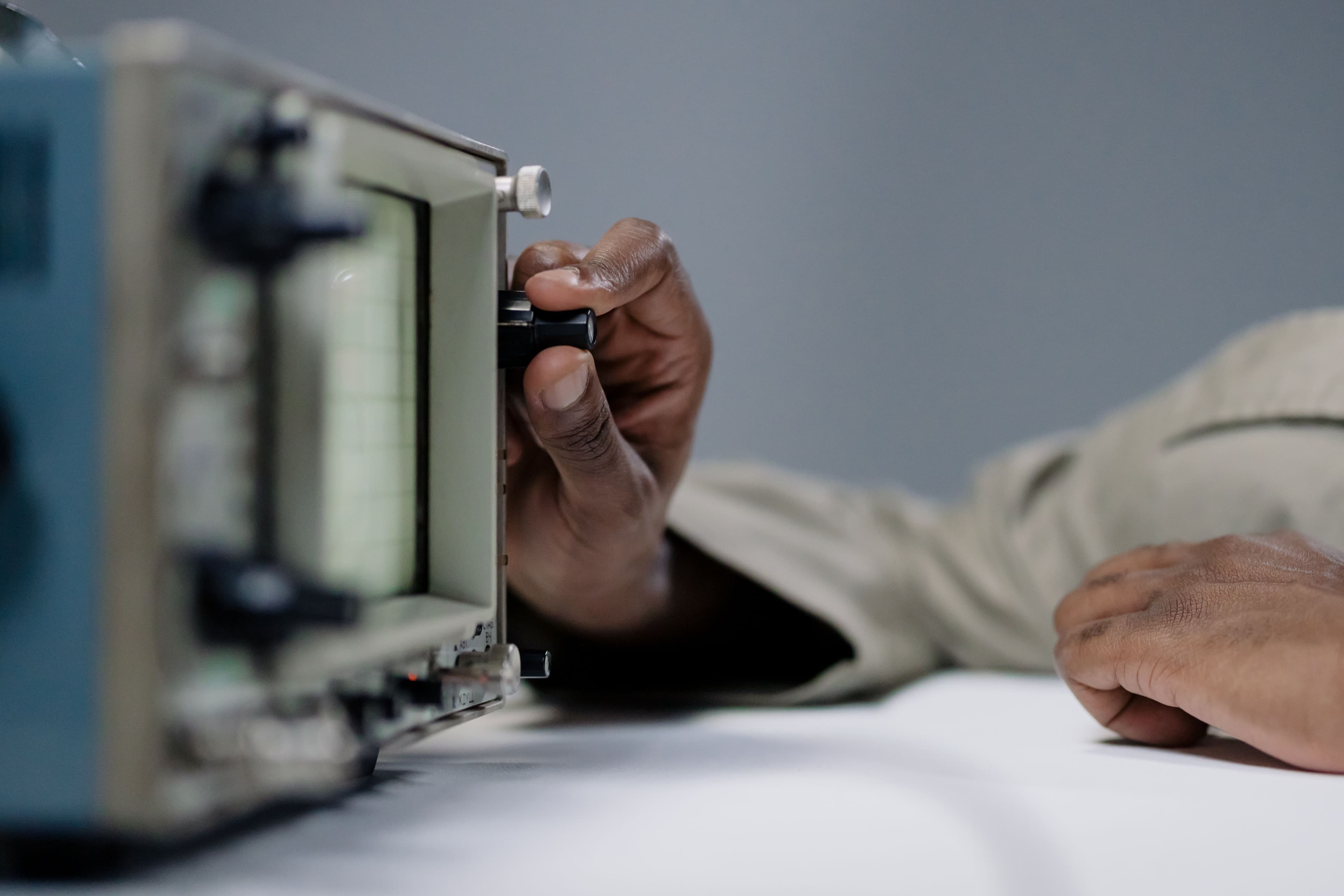Hands fine-tuning settings on a dashboard.
